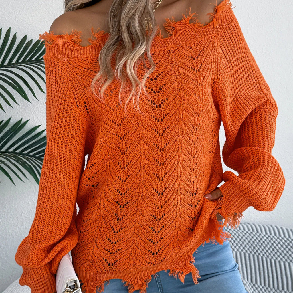 White hollow-out design off-the-shoulder long sleeve acrylic pullover sweater on a hanger.