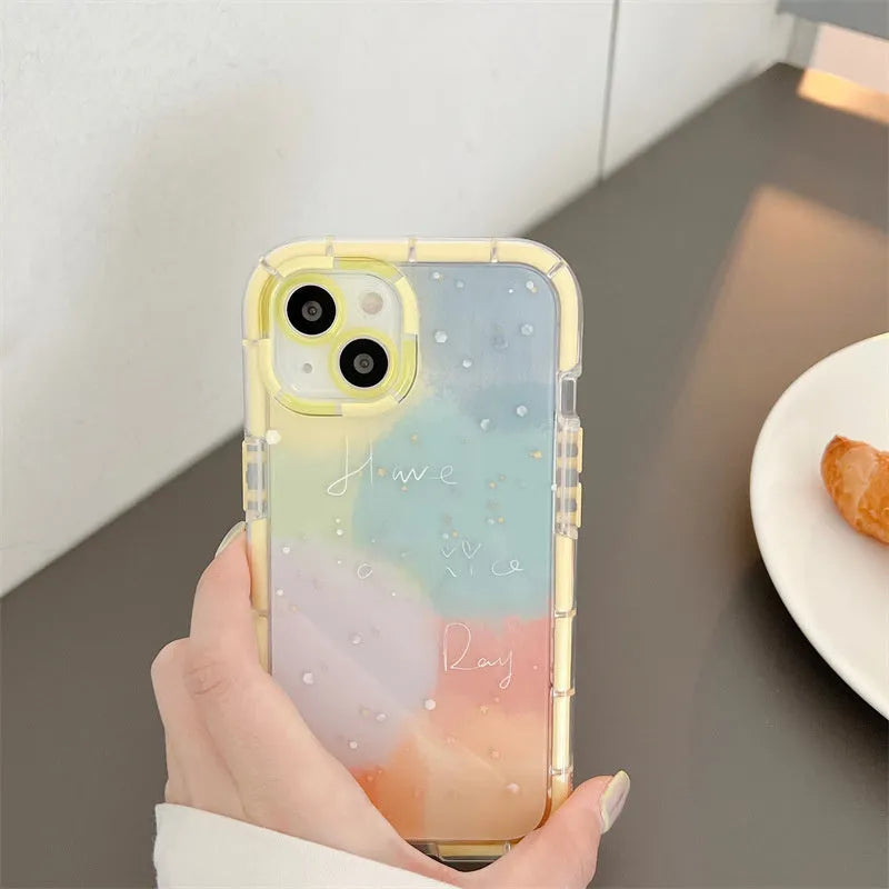 Minimalist yellow edge silicone phone case for iPhone 14 on a table.