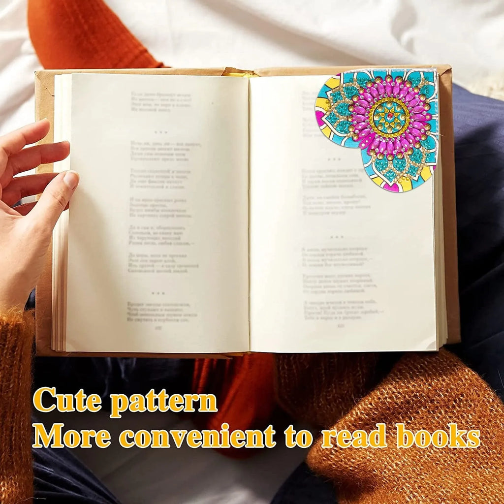 Six handmade PU leather bookmarks with crystal and floral corner designs on a book.