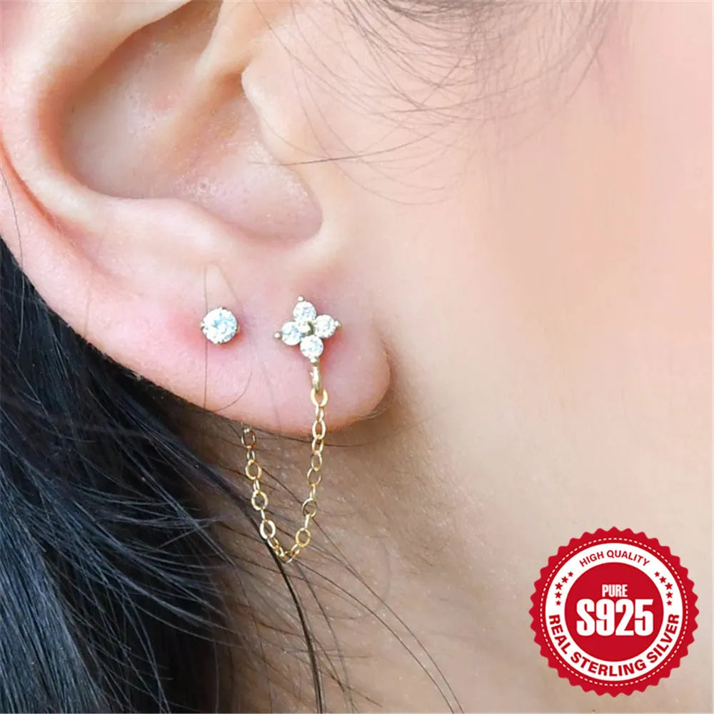 S925 sterling silver geometric ear studs with diamond flower, tassel, and chain design in electroplated gold.