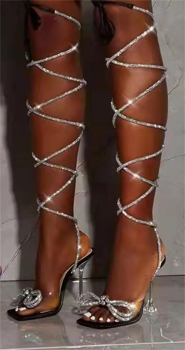 Plus size women's black strappy sandals with rhinestone decoration on the straps and a square toe.