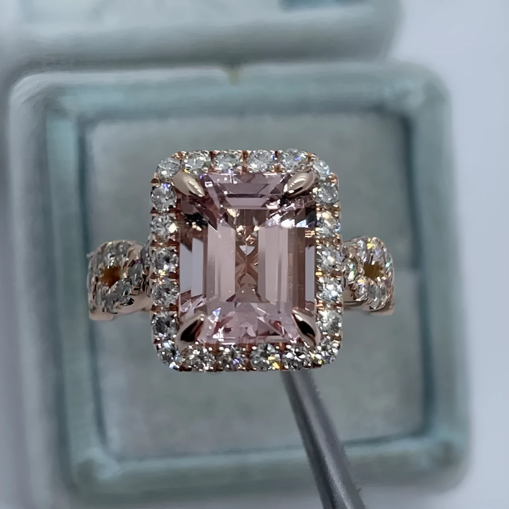 Geometric rose gold coloured alloy ring for women and men on a grey background.