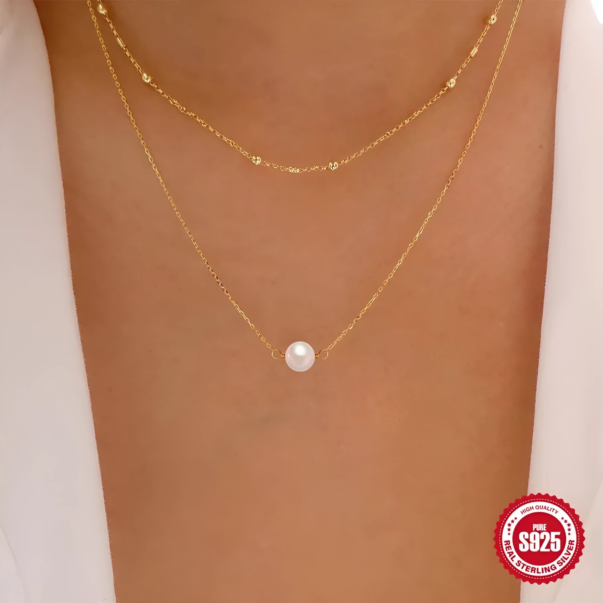 S925 sterling silver double layer necklace with twin diamond-treated pearls and geometric design.