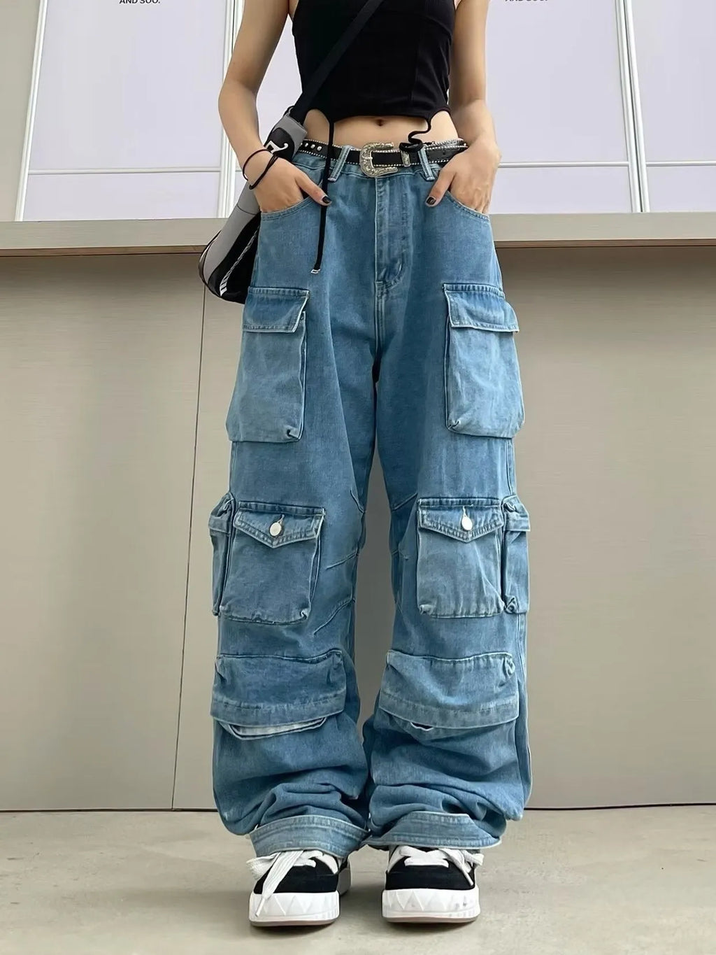 Women's high-waist wide-leg denim jeans with multiple pockets in tie-dyed blue street hipster style