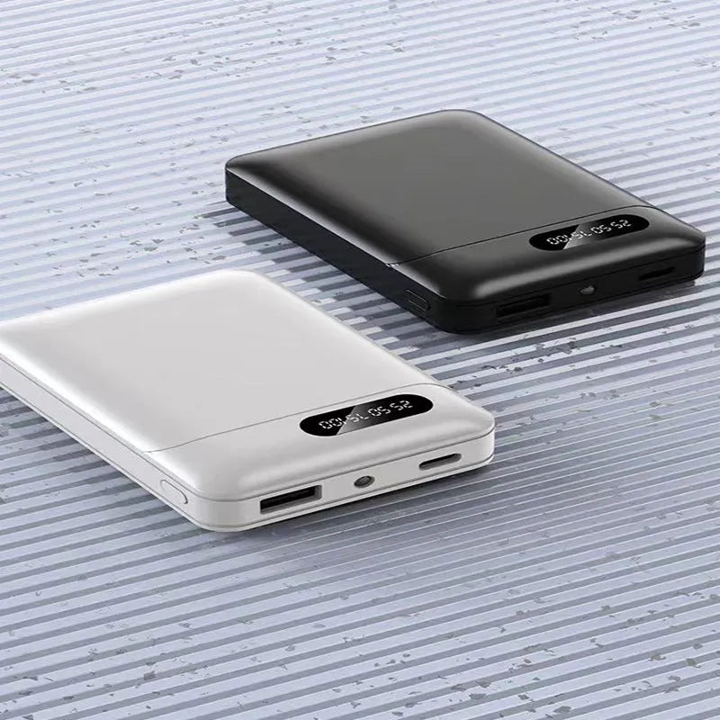 Black and white 10000 mAh portable power bank showing USB ports and dimensions