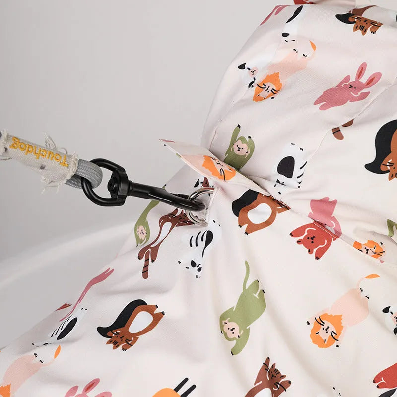 Beige cartoon dog raincoat with animal design showing front leg sleeves and back coverage
