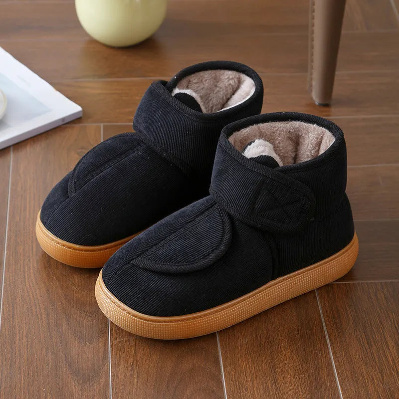 Large opening warm boots with anti-slip rubber soles, unisex slip-on design, plush upper and faux fur lining in black