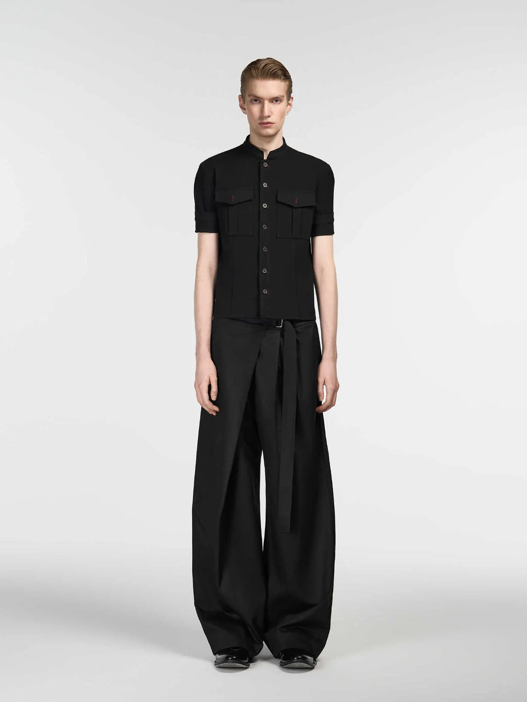 Black women's straight-leg trousers with a single front pleat and adjustable waistband.