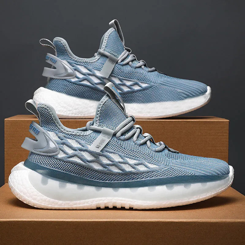 Men's low-top casual sneaker in woven mesh with flat rubber sole and front lace-up closure.