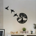 Black electroplated iron wall art designed as a modern simple wind chime hanging ornament.