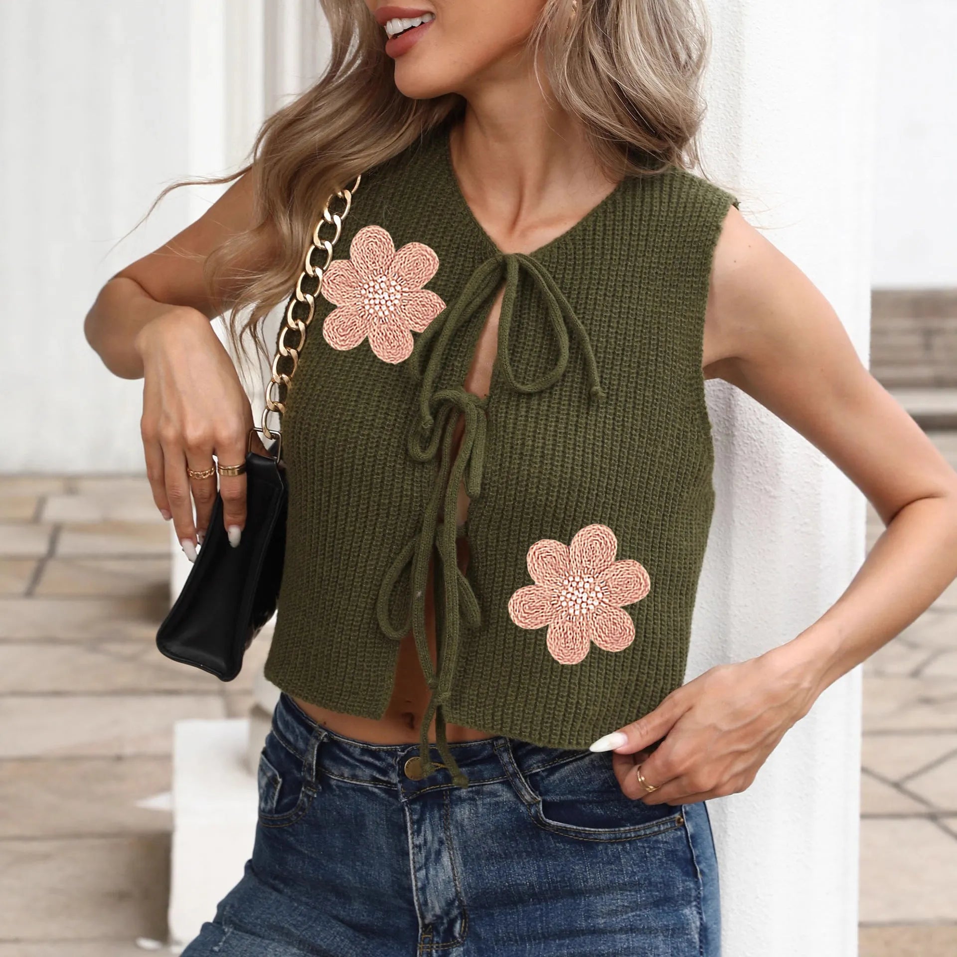 Ladies' sleeveless cardigan vest with lace-up front and bow detailing in deer plush polyester fabric