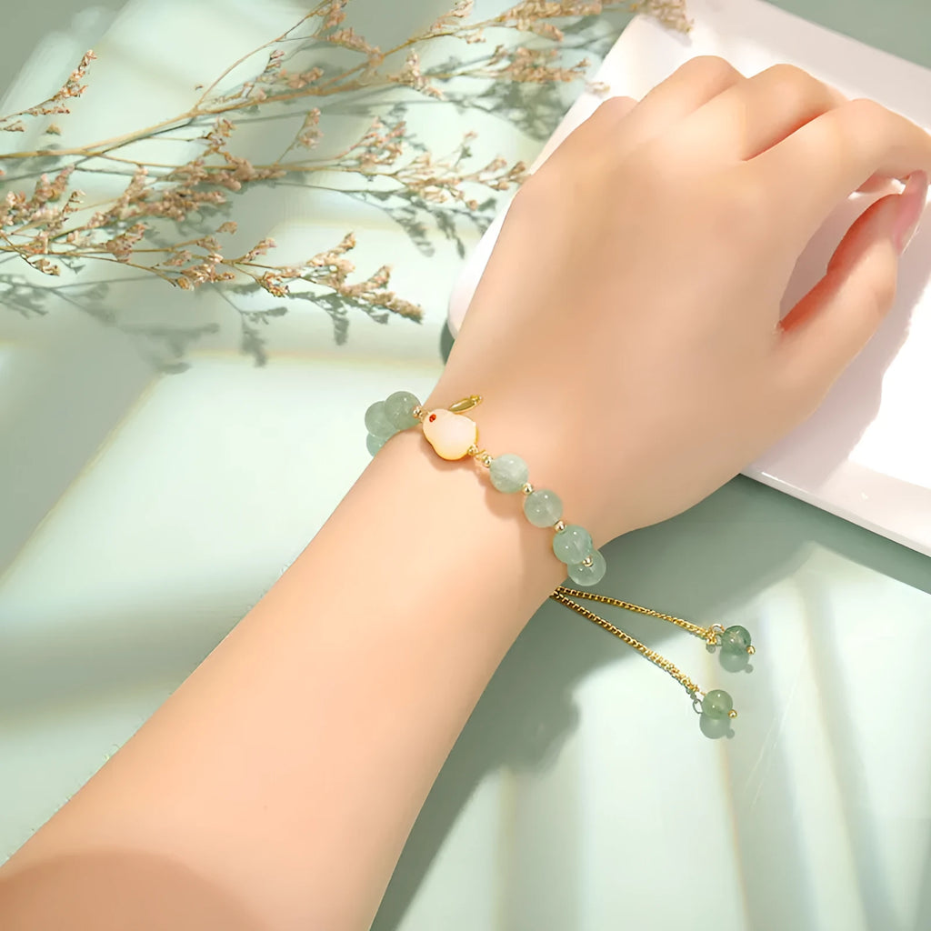 Natural stone rabbit bracelet with green aventurine and strawberry quartz beads, copper plating and gold accents