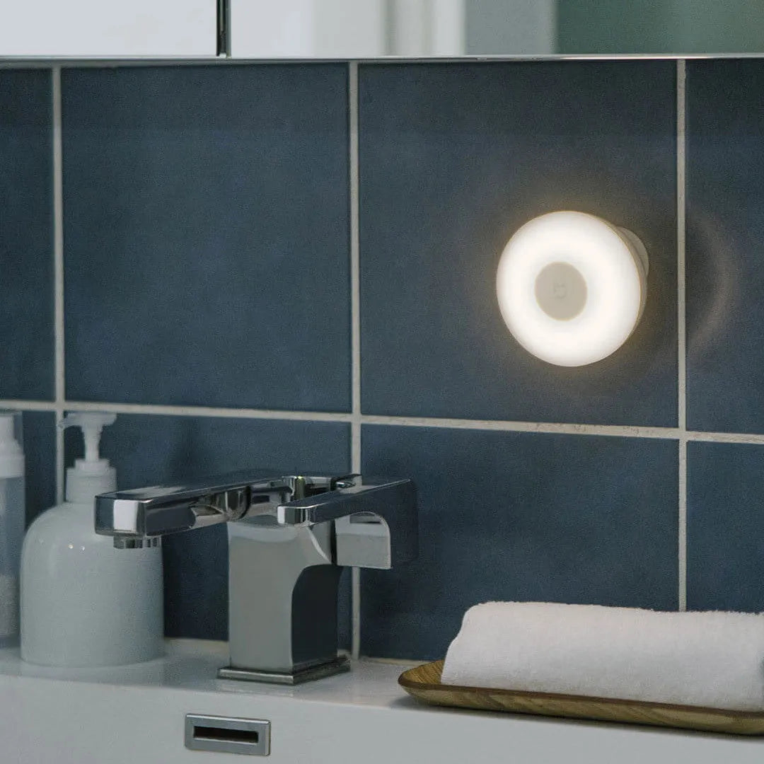White modern Mijia Night Light 2 Bluetooth bedside lamp with human body induction on wooden table