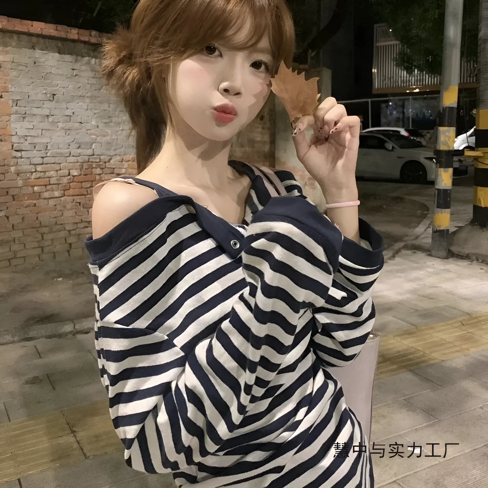 Dark blue striped women's oversized t-shirt with embroidery and button details