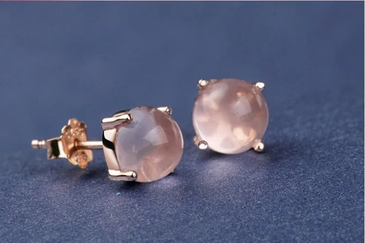 Women's rose gold drop shape stud earrings with crystal inlay detail