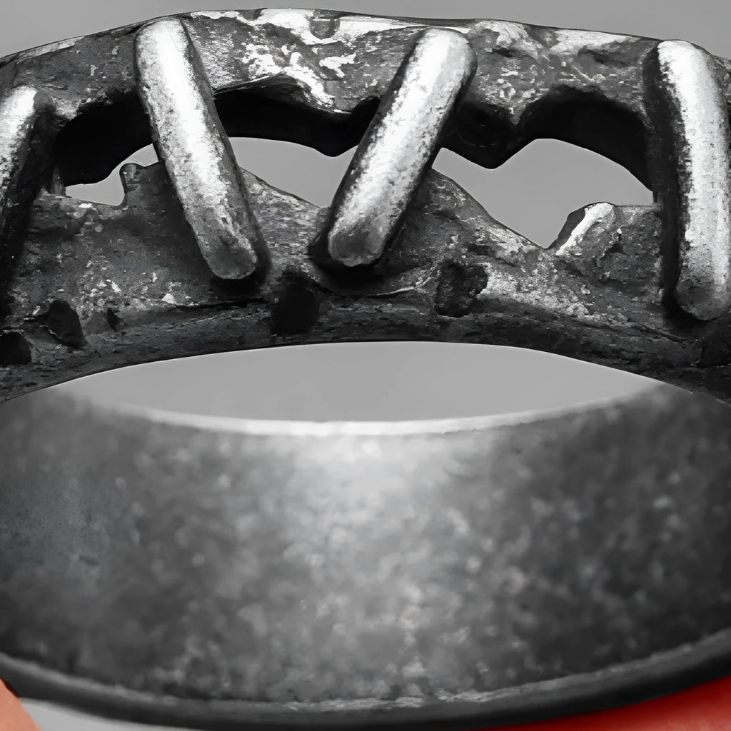 Stainless steel dark punk stitching style double ring on a finger, showing the textured design.