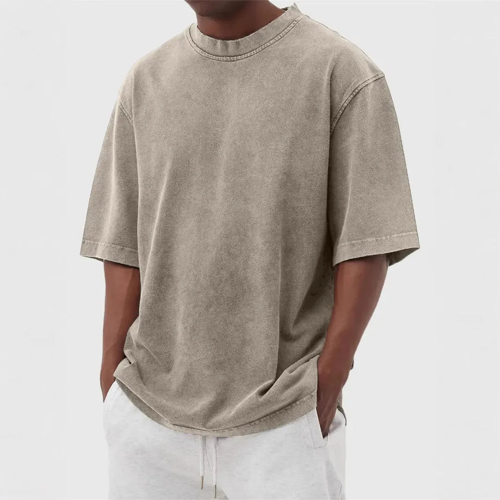 Men's loose fit stone washed polyester t-shirt in army green colour, showing distressed texture and short sleeves.