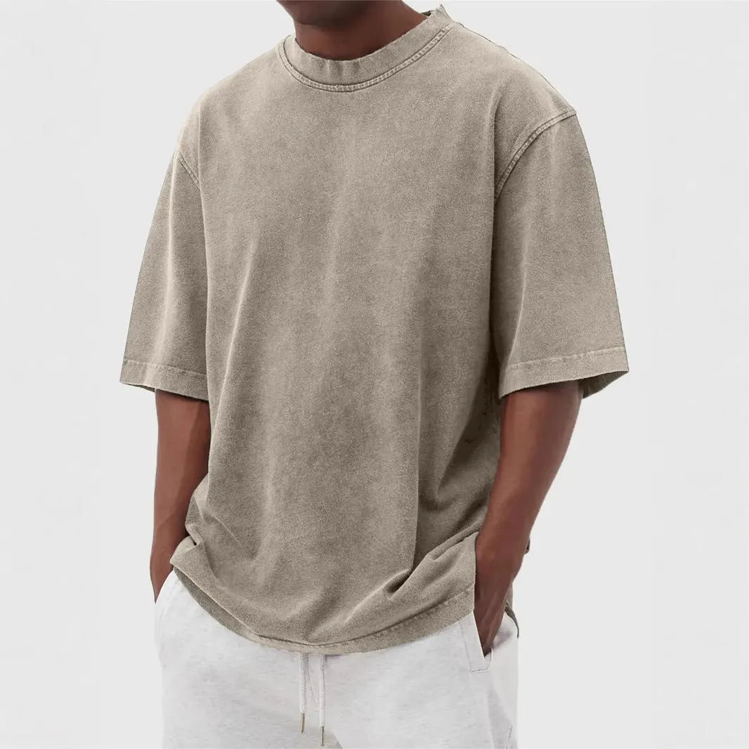 Men's loose fit stone washed polyester t-shirt in army green colour, showing distressed texture and short sleeves.