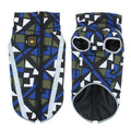 Dog wearing thick reflective winter jacket in geometric blue colour with European styling