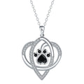 Silver tone necklace with cat and dog paw print pendant on cross chain for women