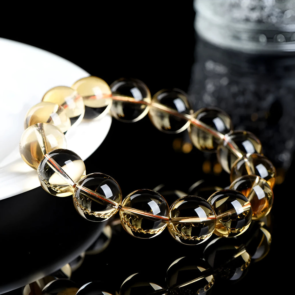 Natural citrine scattered beads bracelet showing polished gemstones in an original design on a wrist.
