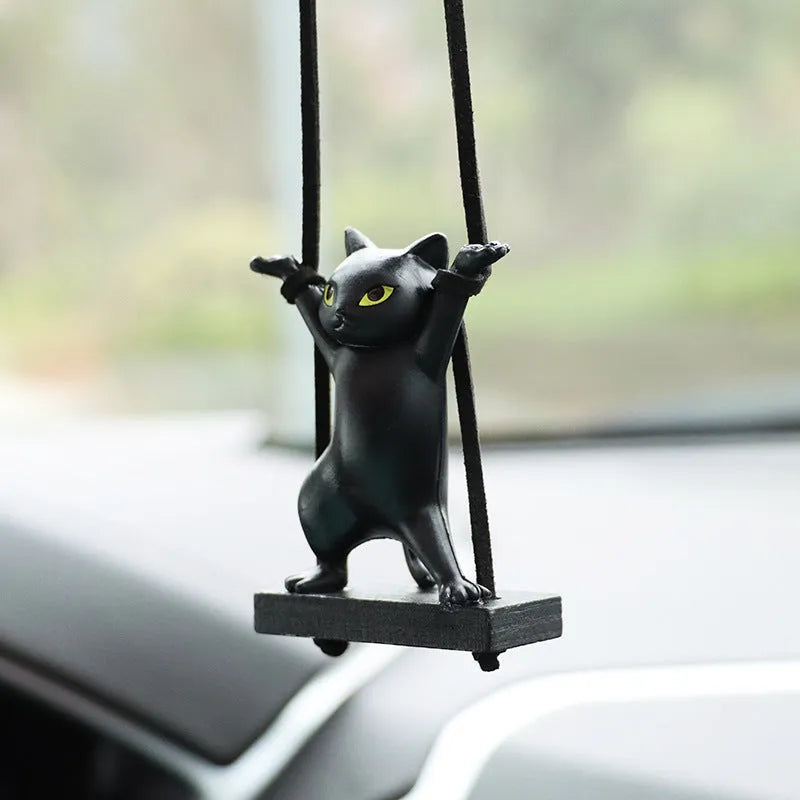 Resin cartoon cat pendant for car interior decoration on a rope, shown in multiple colour options.
