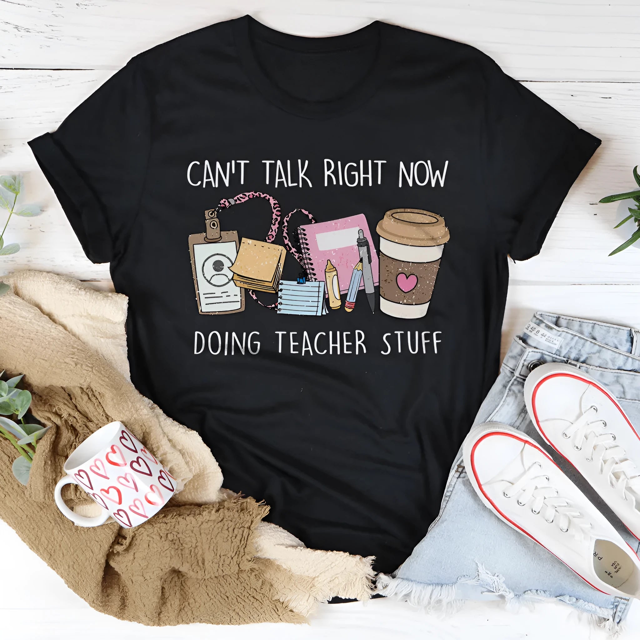 A black loose-fit cotton t-shirt with short sleeves and a crew neck, laid flat.