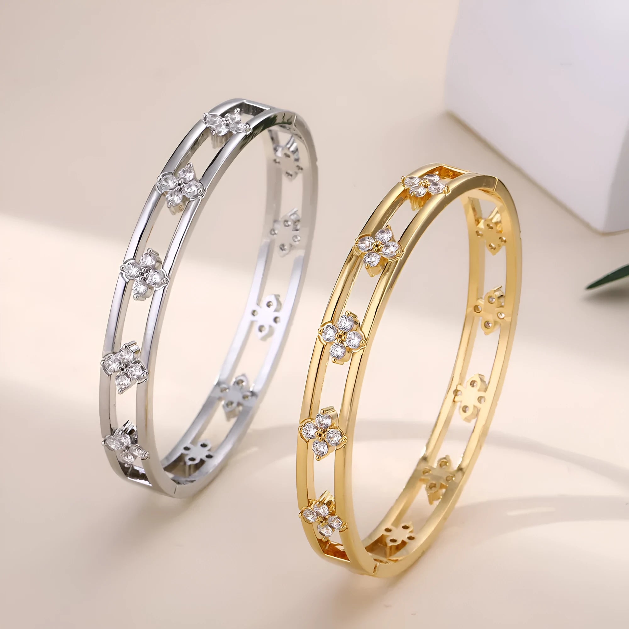 Gold and silver buckle options of hollow women's bracelet with four-leaf clover inlaid zircon design