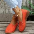 Women's white PU leather slip-on loafer flats with round toe and rubber sole on a plain background.