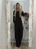 Casual long sleeve top and trousers lounge set in black, shown on a hanger