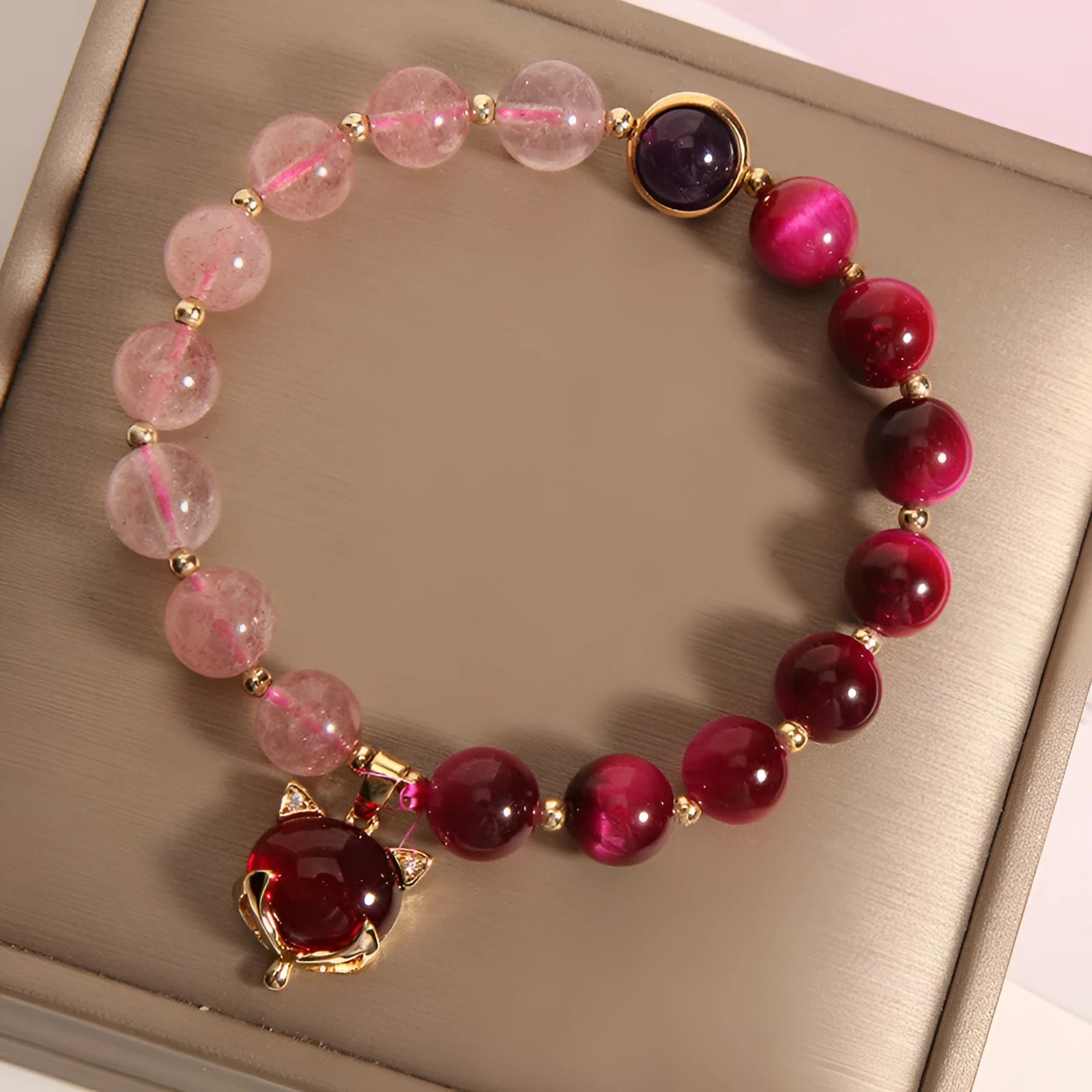 Simple strawberry crystal bracelet for women with elastic band, showing natural stone detail.