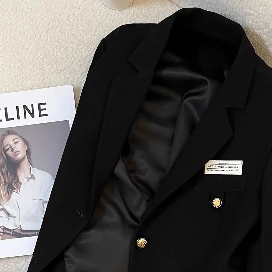 Women's black short suit coat with loose fit design and regular sleeves