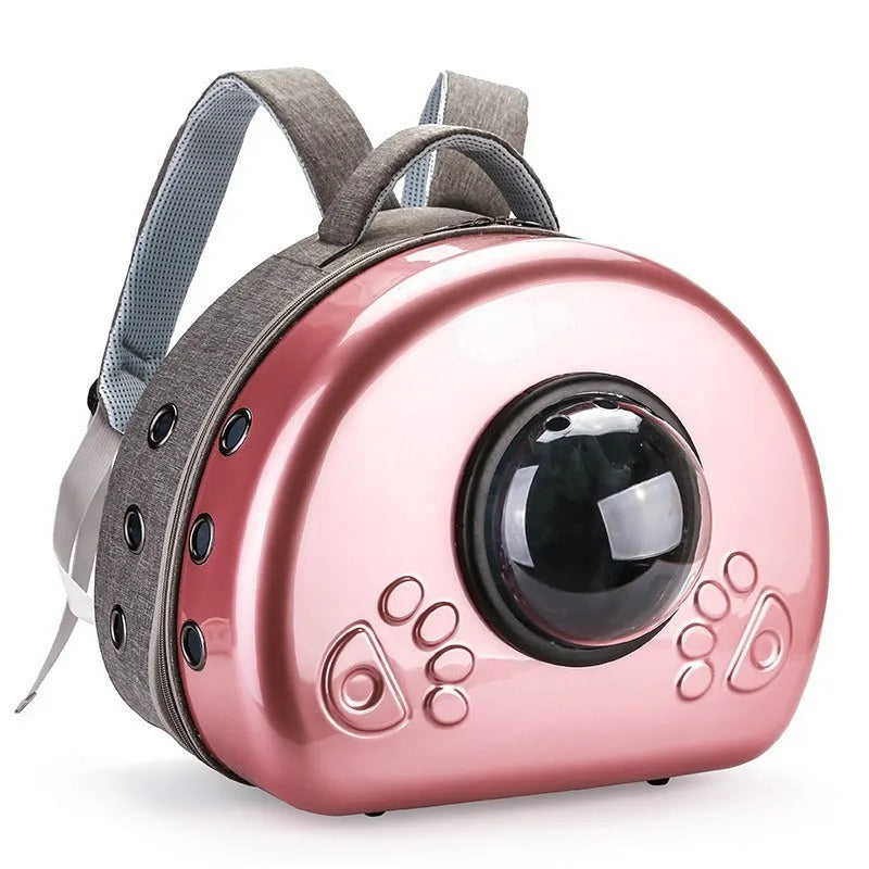 Transparent space capsule cat carrier backpack in PC canvas with metallic hard shell cover.