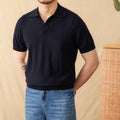 Purple short sleeve polo shirt with a seagull collar and a sunken stripe knitted pattern.