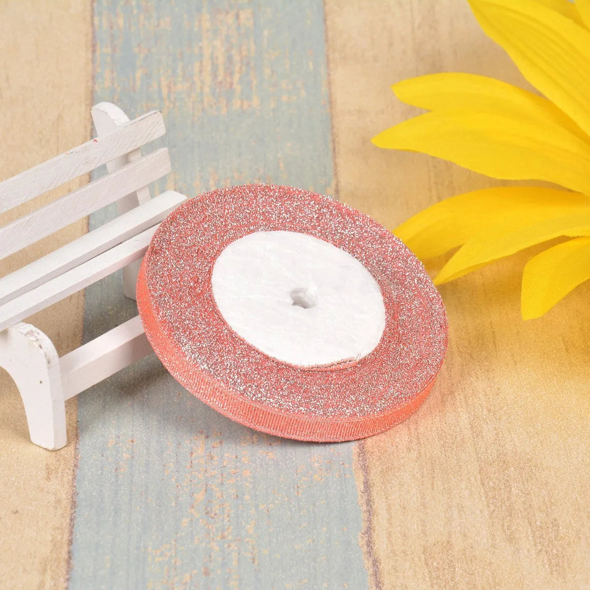 Green onion coloured polyester ribbon with gold polka dots on 25-yard spool for decorative trimming