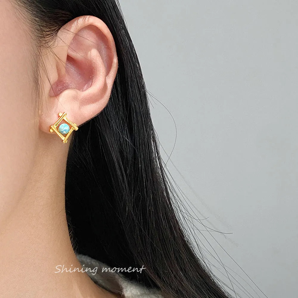 Geometric cross quadrangle sterling silver 925 stud earrings for women in gold and silver finishes.