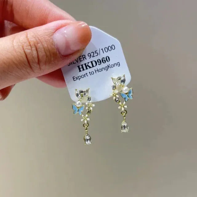 Geometric heart-shaped women's ear clips with rhinestone, star and tassel decorations on alloy.