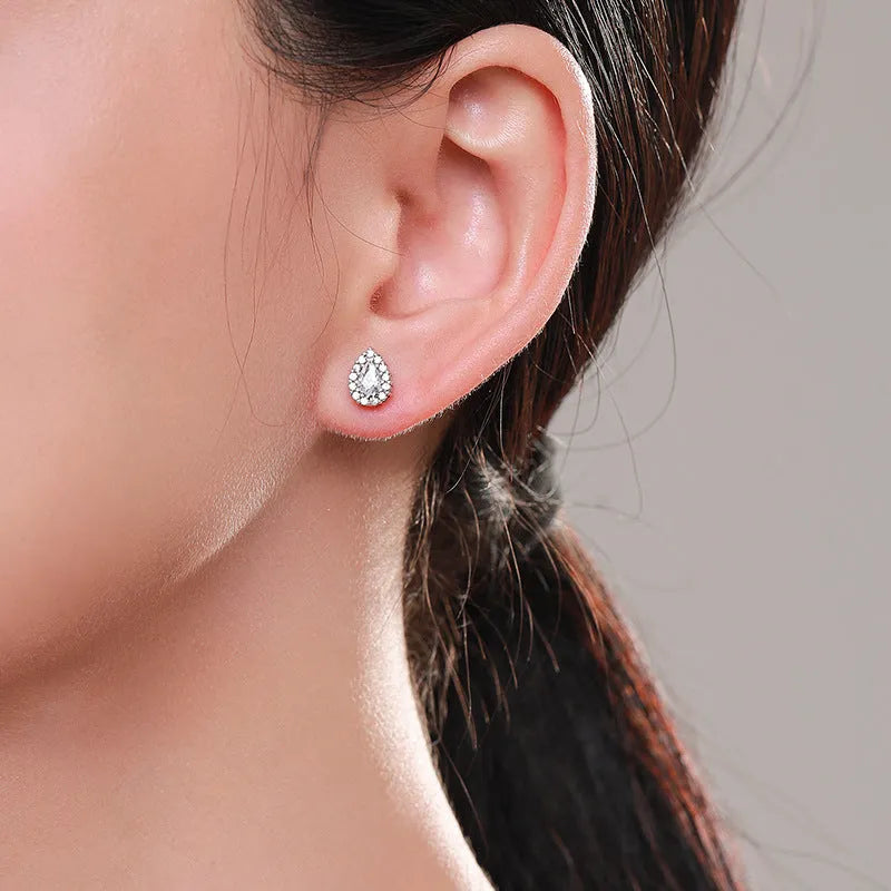 Women's silver water drop ear studs made from 925 sterling silver with diamond treatment