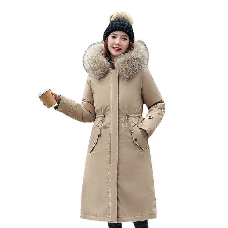 Women's long beige trench coat with fleece lining and button front.