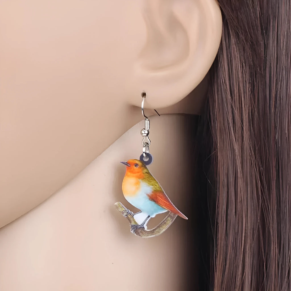 Acrylic blue titmouse pendant earrings with geometric animal zodiac design and printed snake pattern