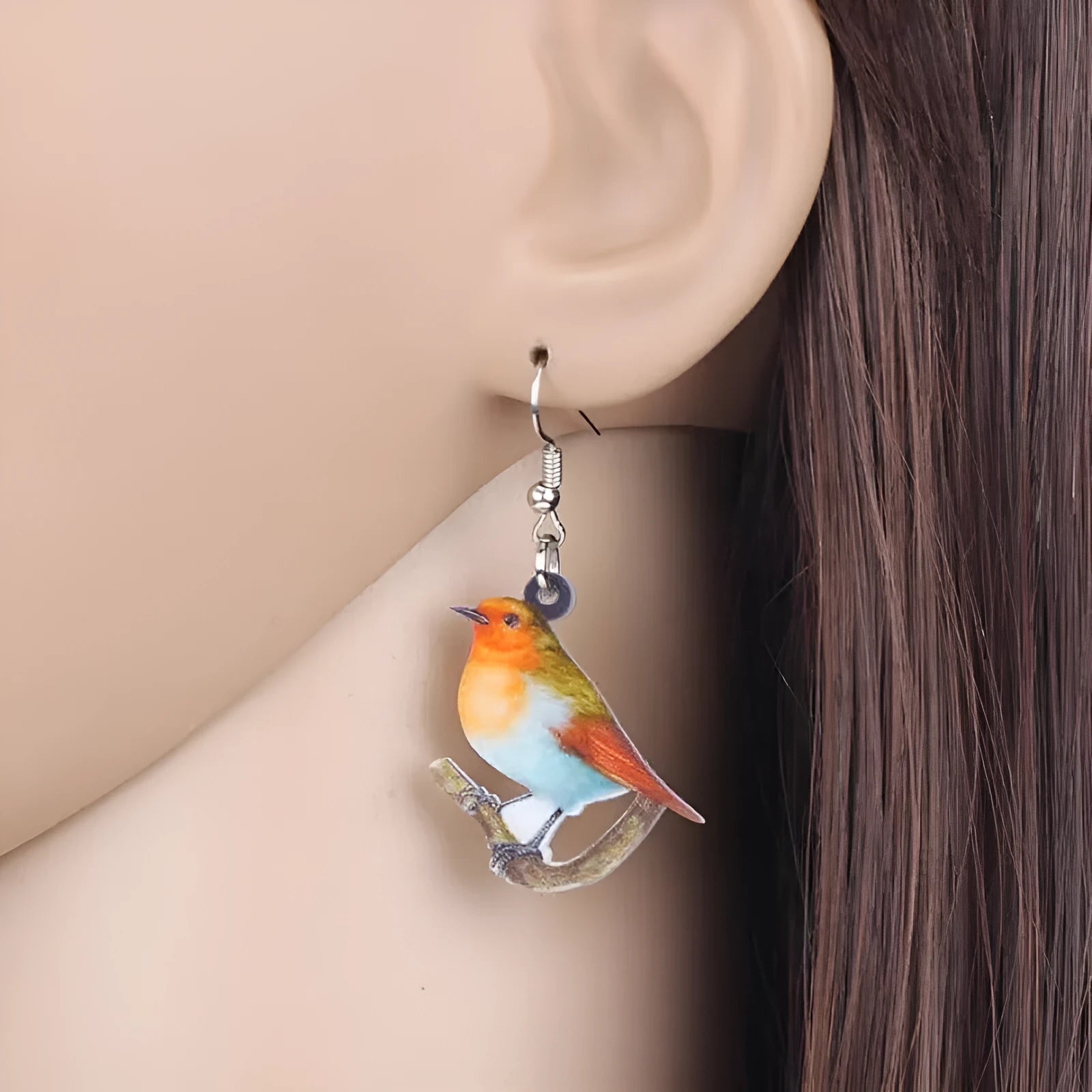 Acrylic blue titmouse pendant earrings with geometric animal zodiac design and printed snake pattern