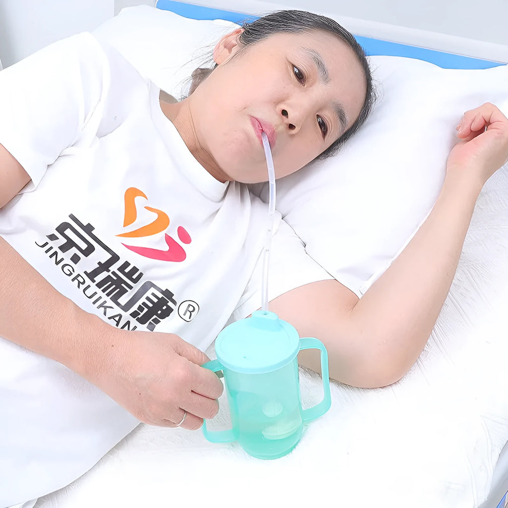 Oblique mouth anti-choke drinking cup for elderly adults with handle, lid, and optional wrist splint.