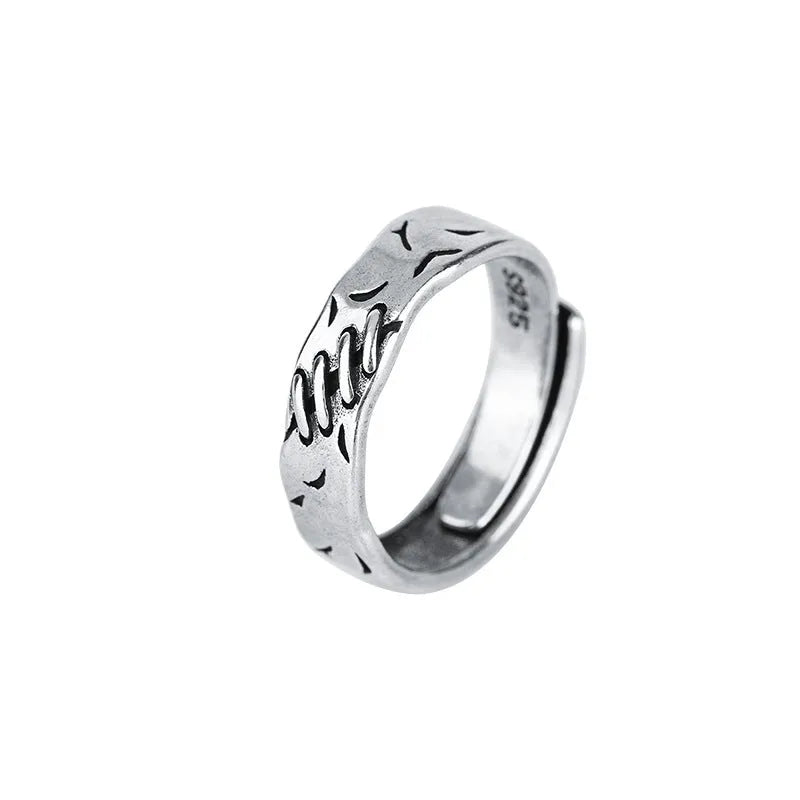 Black geometric copper ring with adjustable opening and oval design elements for women's fashion jewellery