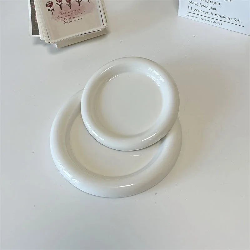 White porcelain plate with cute bear doodle design, 20cm size, on a table.