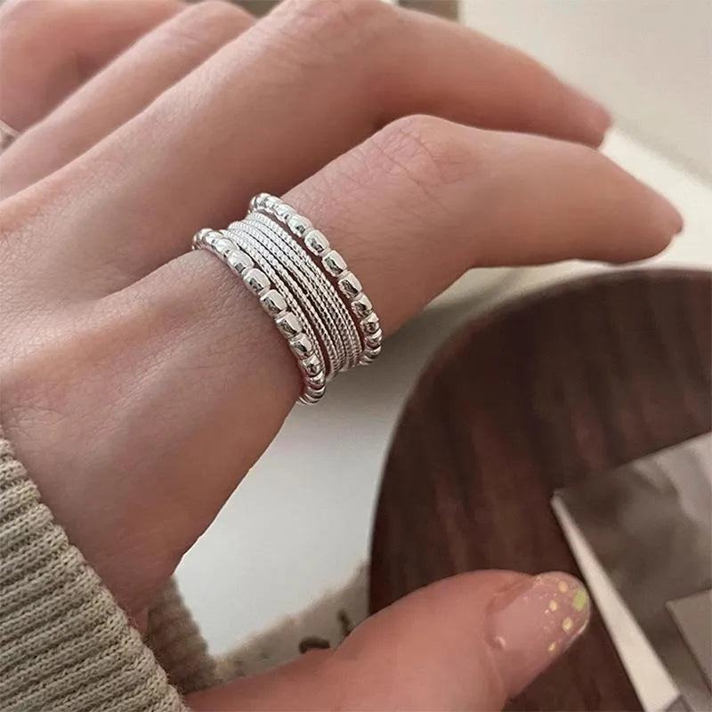 Copper geometric ring with adjustable opening and woven twisted multilayer design