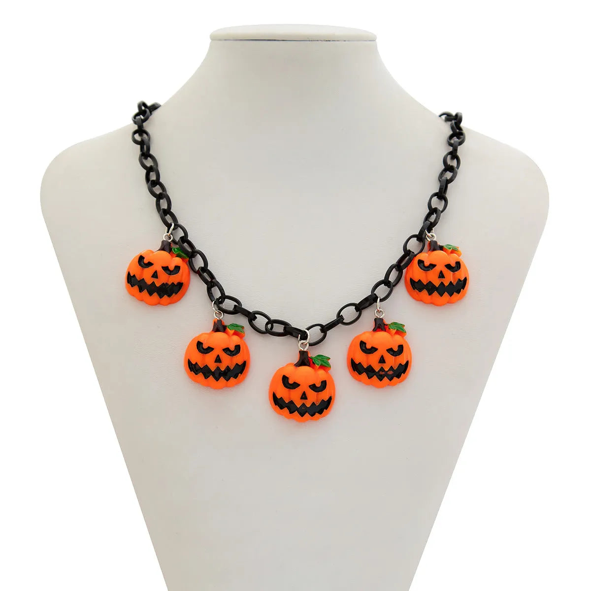 Colourful Halloween necklace showing a cartoon ghost pumpkin pendant on a chain.