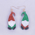 A pair of acrylic earrings shaped like cartoon Santa Claus figures with coloured hats.