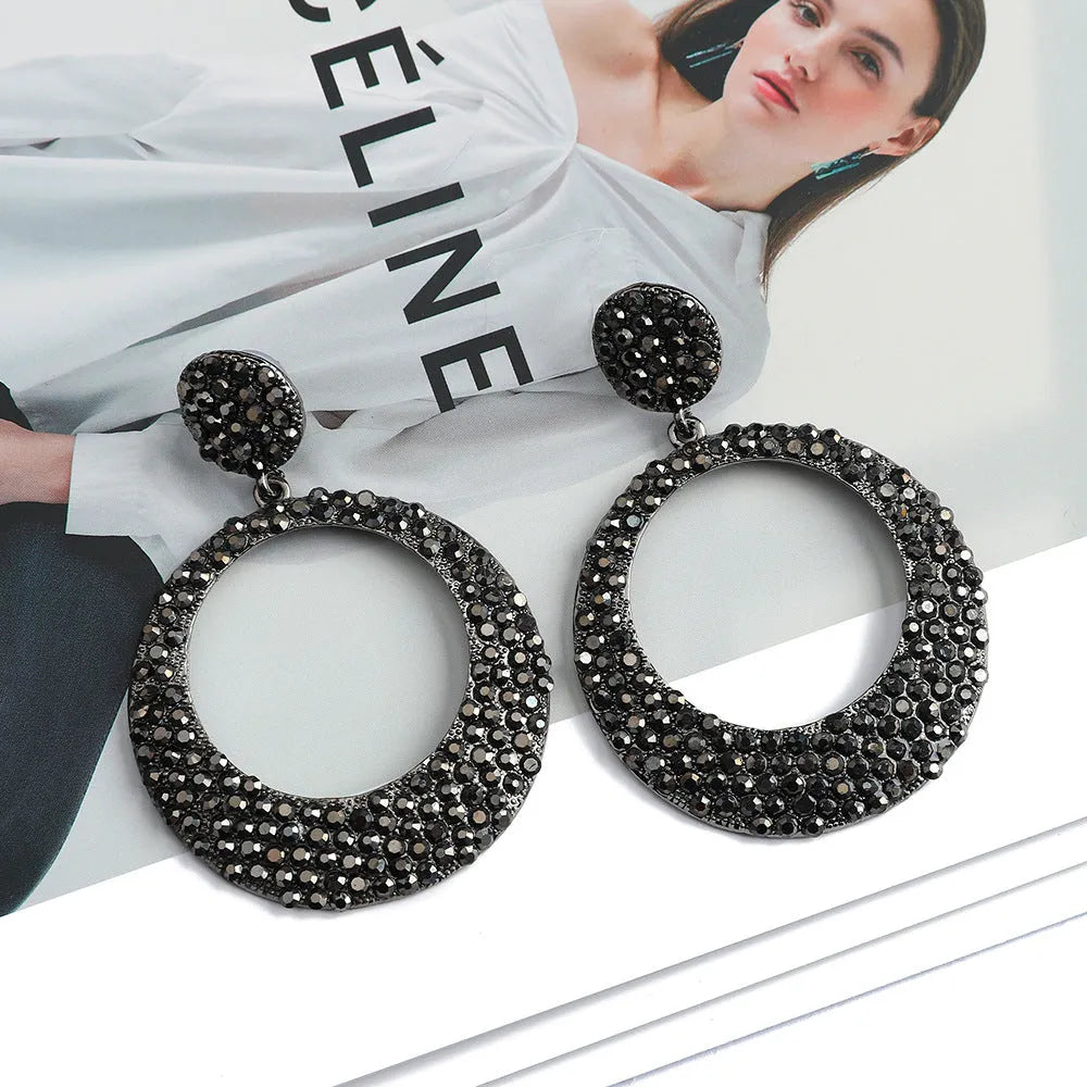 Cartoon-style metal alloy earrings with large diamond pendant drop in various colour options