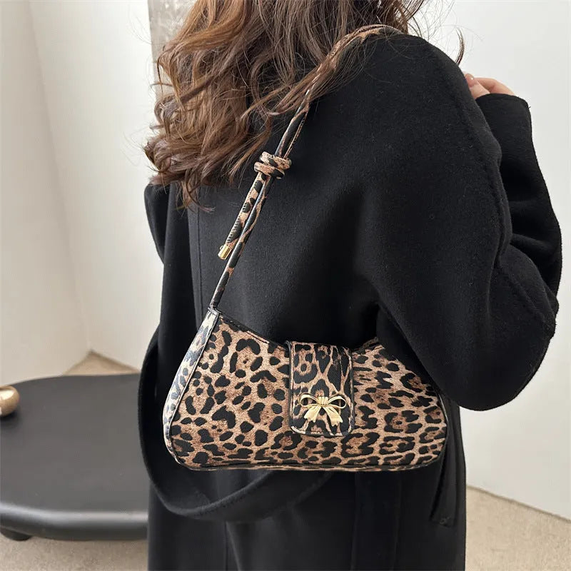 Casual large capacity PU handbag for women in black, shown with outer sandwich pocket.