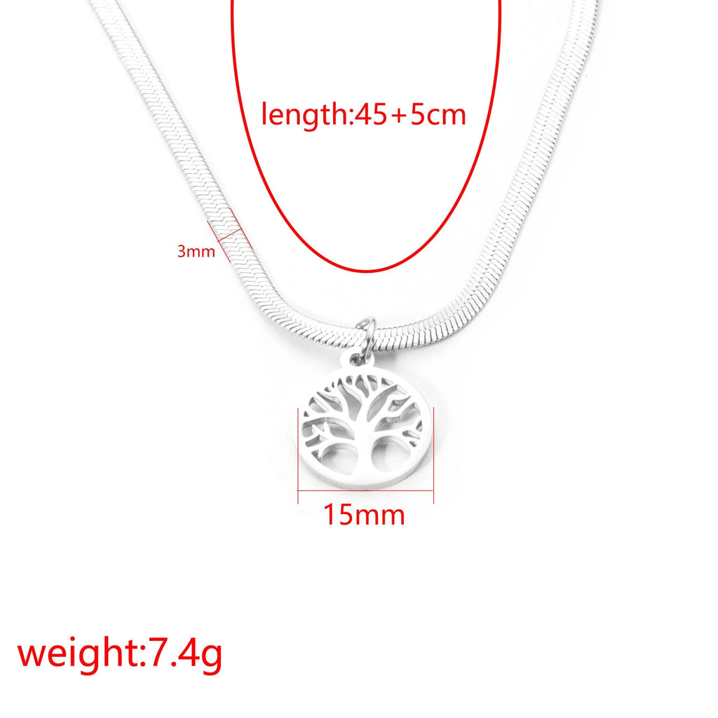 Steel colour tree pendant necklace with a textured snake bones chain on a neutral background.